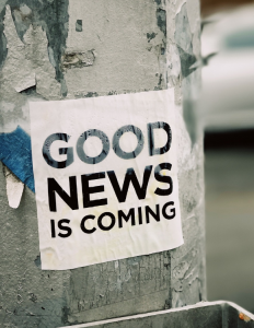 street poster reading 'good news is coming'