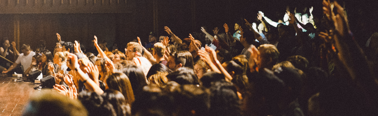 Class full of students with raised hands